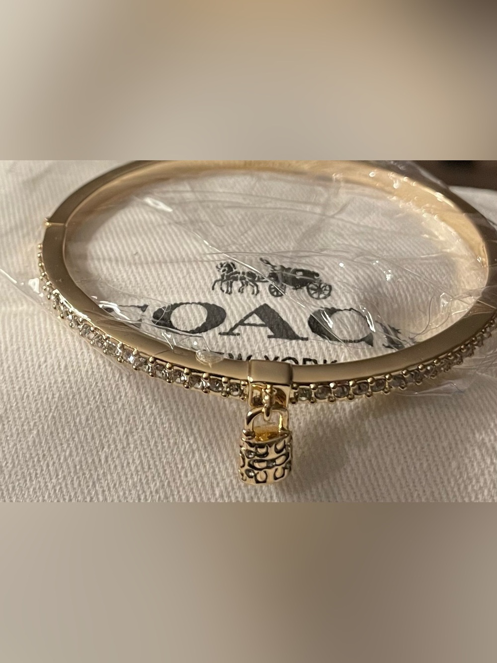 Coach Gold Pavé Bangle Bracelet with Signature Padlock Charm